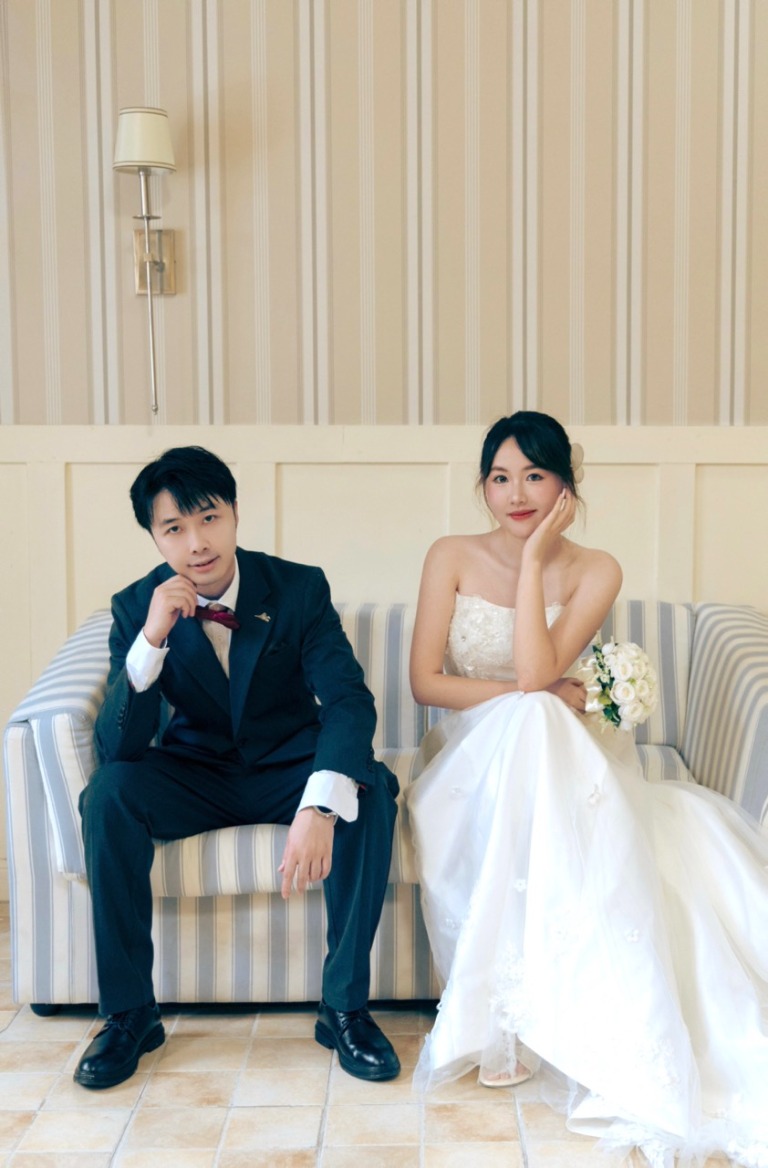 The couple resting together on a sofa